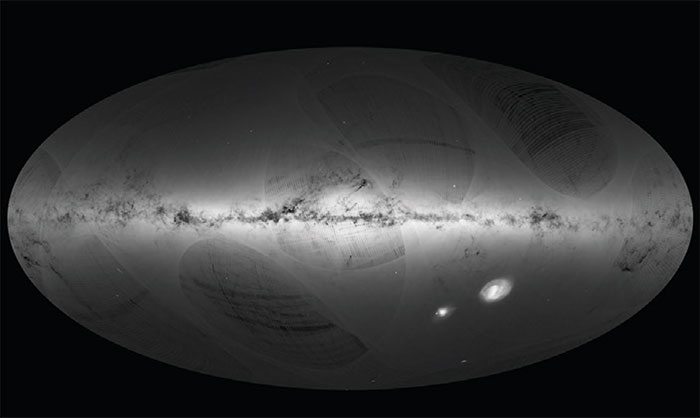 CCast1_09_16 An all-sky view of stars in the first Gaia catalogue. With a dot for each star, the map outlines the Milky Way (horizontally) and the Magellanic Clouds (lower right). The curved features are artifacts due to Gaia’s scanning procedure. Image credit: ESA/Gaia/DPAC.